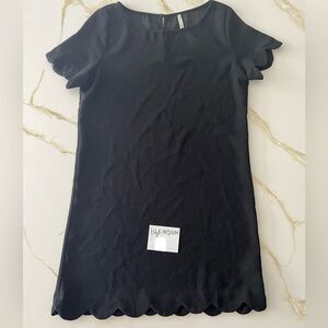 Size Medium black dress for sale. Scalloped sleeves & hem. Good condition.